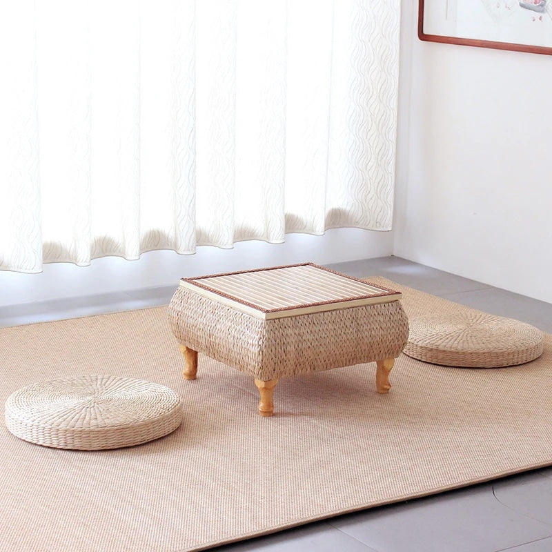 Square wicker coffee table with a storage chest beneath the top – shown in a room setting