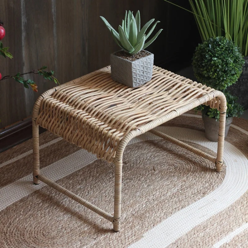 Rectangular wicker coffee table on natural wood legs – shown in a room setting (2)