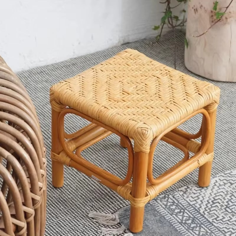 Square Nordic wicker stool with a tight hand braid – shown in a room setting (2)