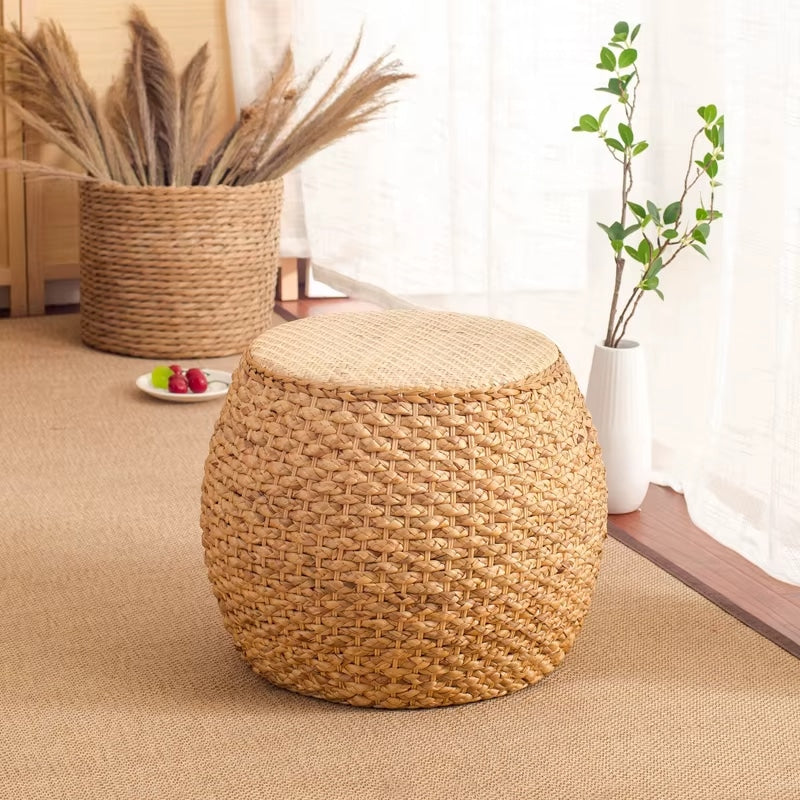 Minimalist round wicker stool with a tightly woven seat – shown in a room setting (2)
