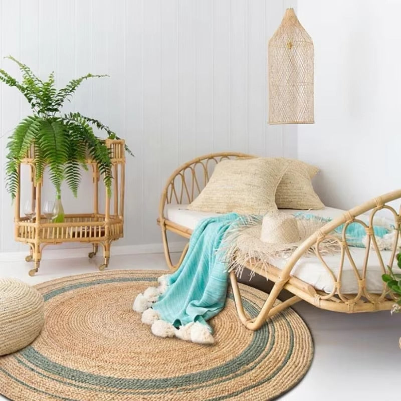 Traditional round handmade woven rug with circular motifs – shown in a room setting (2)