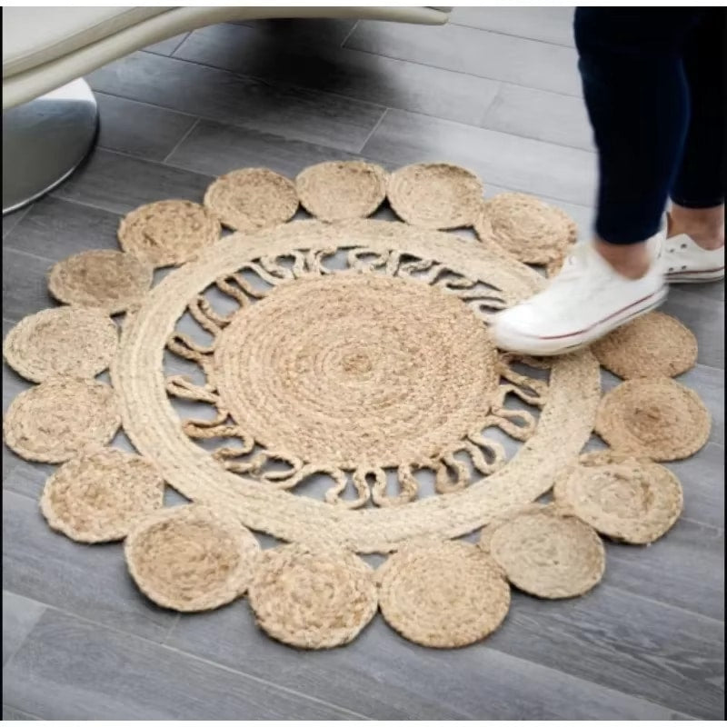Neutral wicker-look woven rug with warm highlights – shown in use