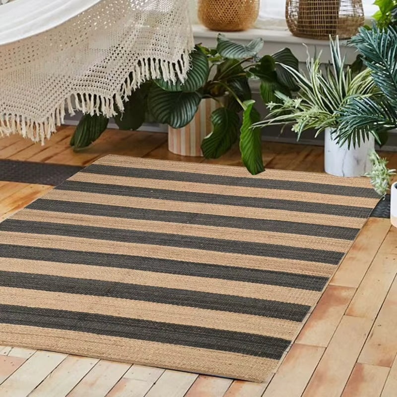 Striped rectangular handwoven wicker rug – shown in a room setting (2)