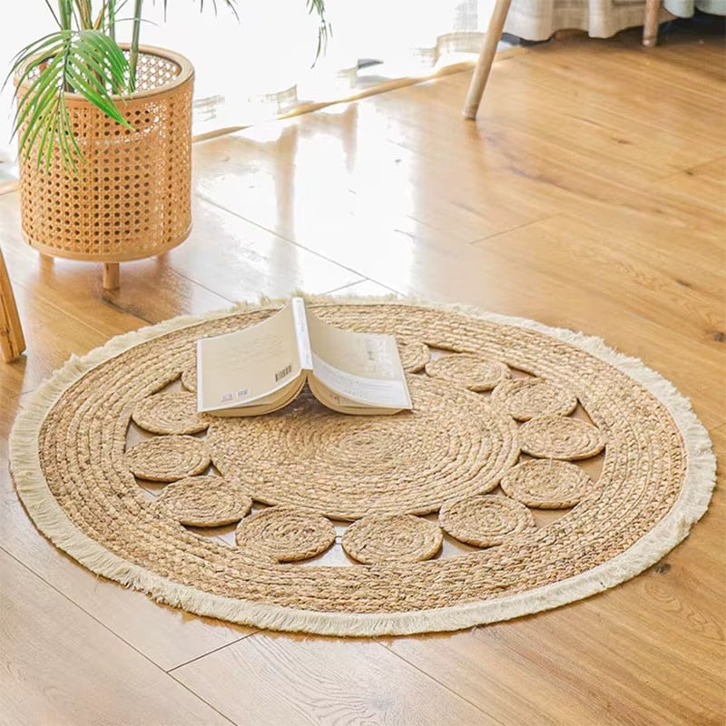 Round wicker rug with white knotted fringe – shown in a room setting