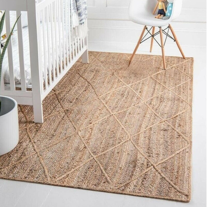 Rectangular rattan rug with a regular cross pattern – shown in a room setting