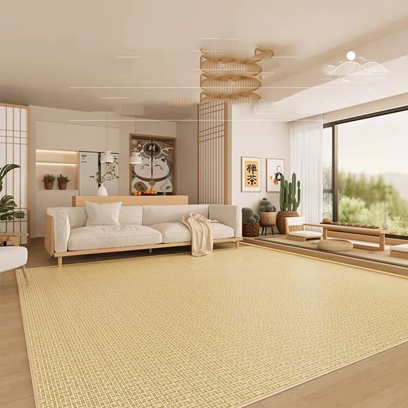 Square rattan rug with a geometric relief pattern – shown in a room setting
