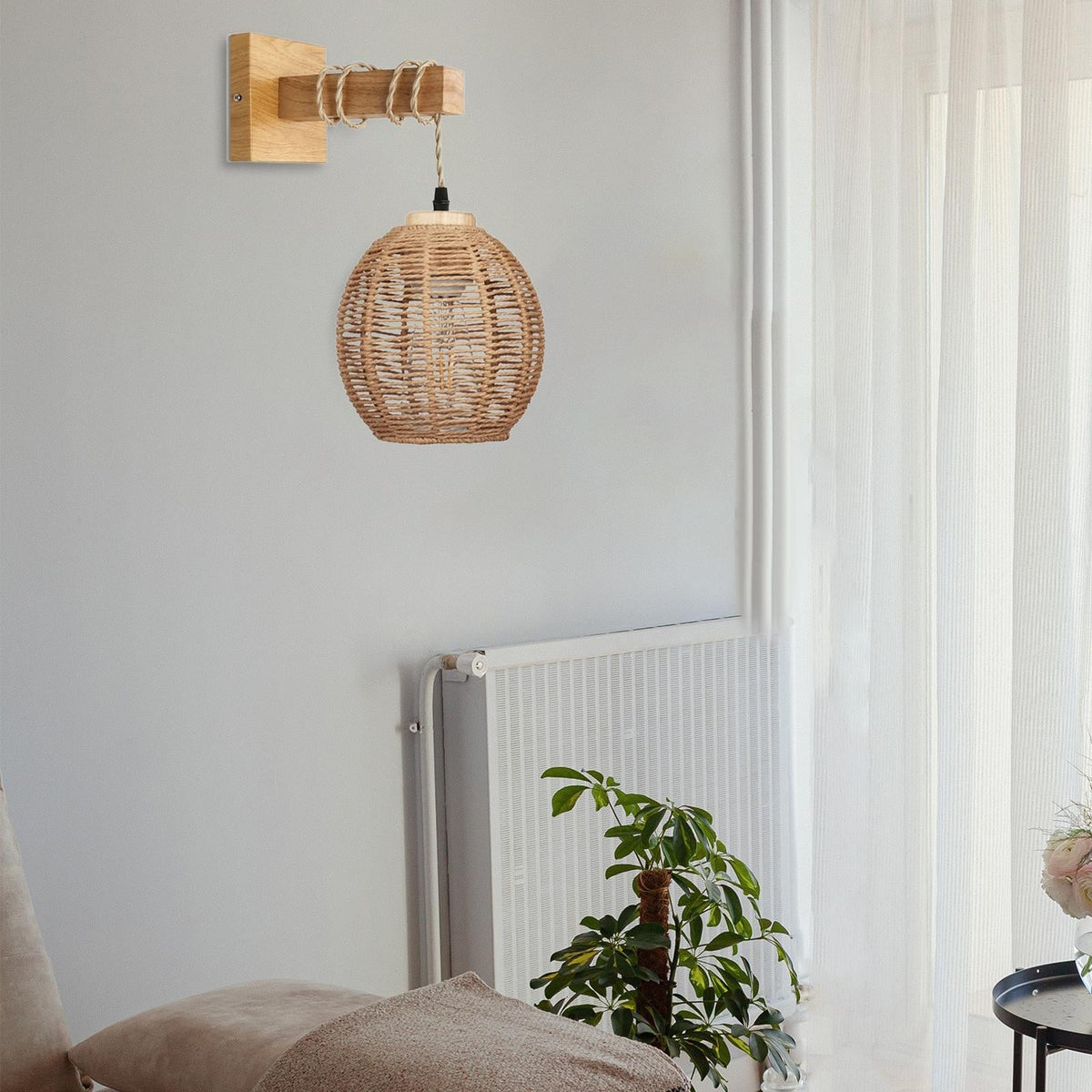 Hanging handwoven rattan ball wall light – shown in a room setting (3)