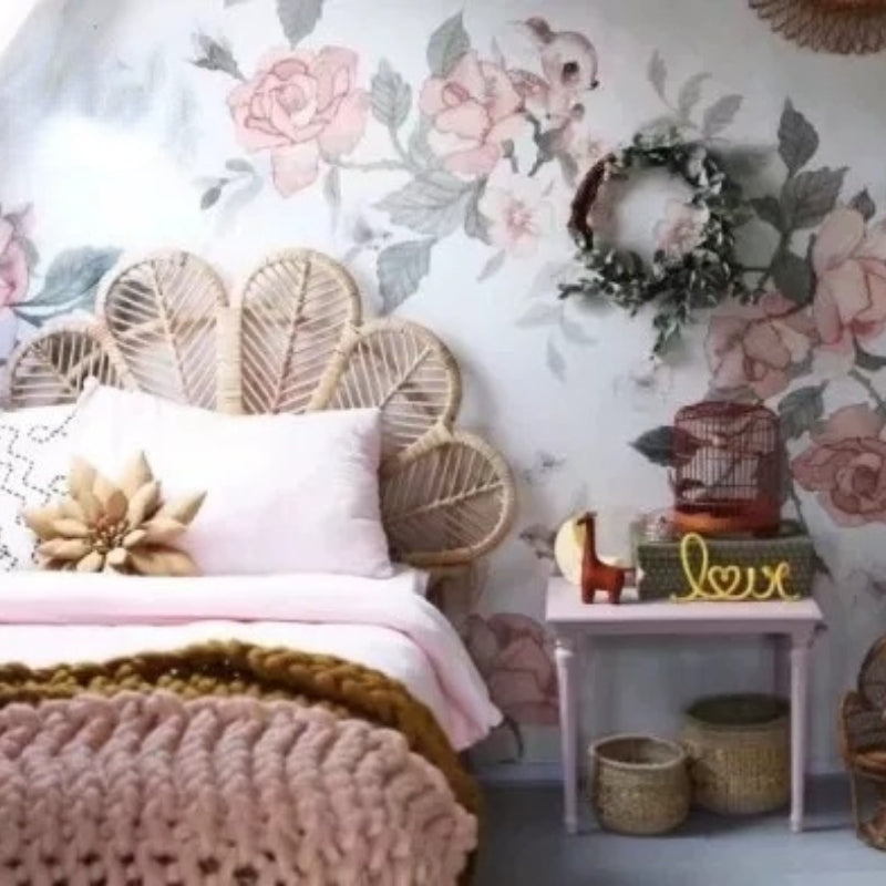 Light rattan headboard shaped as six hand-braided leaves – shown in a room setting
