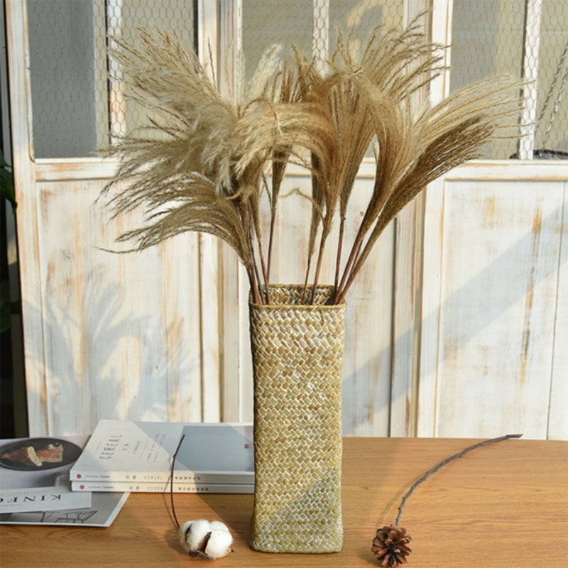Small handwoven rattan flower vase – shown in a room setting
