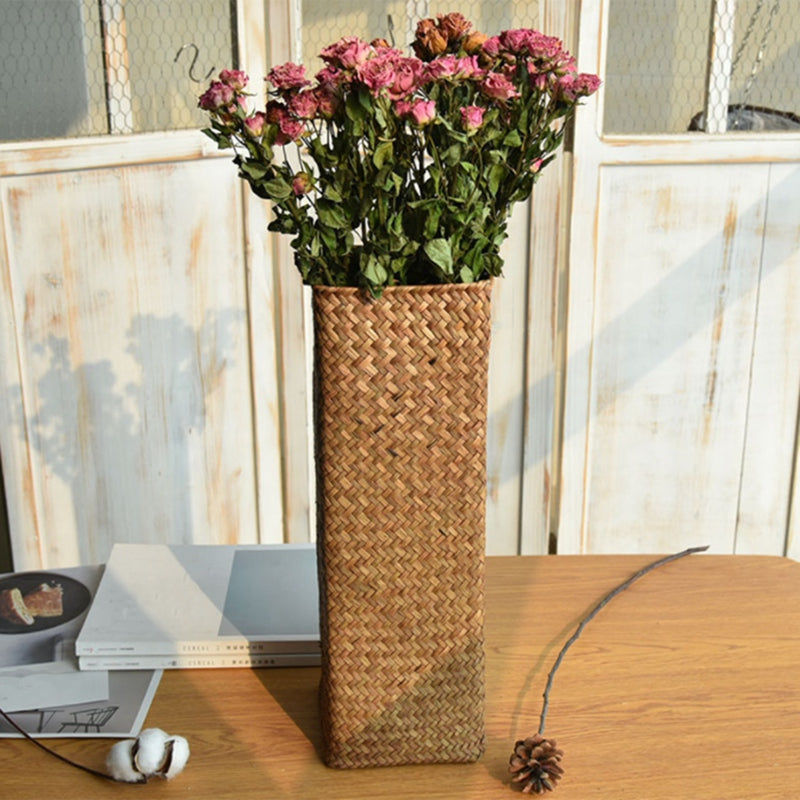 Small handwoven rattan flower vase – shown in a room setting (2)
