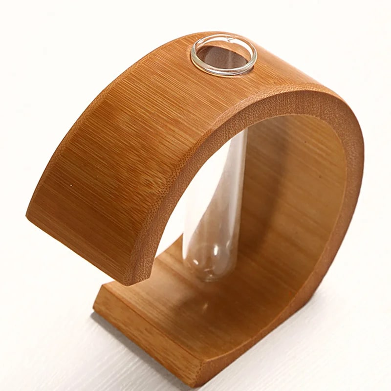 C-shaped bamboo vase with a clear glass tube