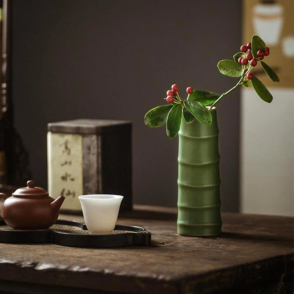Soft green ceramic vase with bamboo-look ribs – shown in a room setting (3)