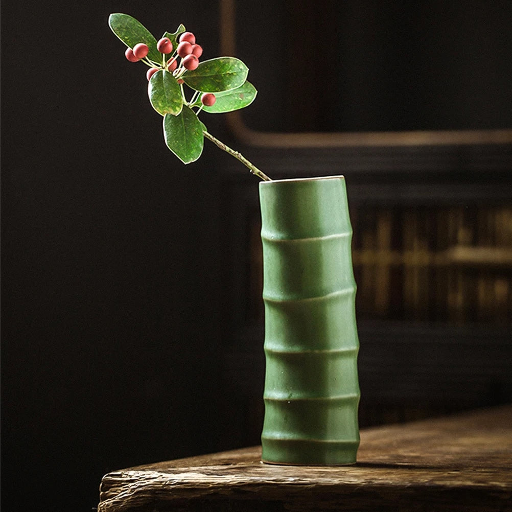Soft green ceramic vase with bamboo-look ribs – shown in a room setting