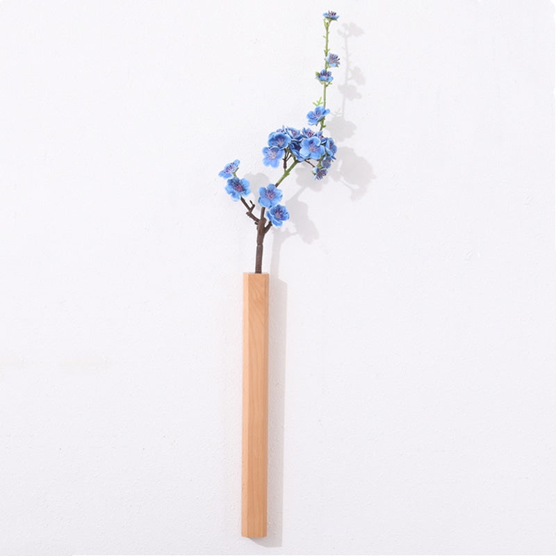 Slender light wood wall vase