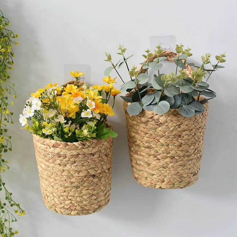 Hanging wicker vase with a small braided loop – shown in a room setting