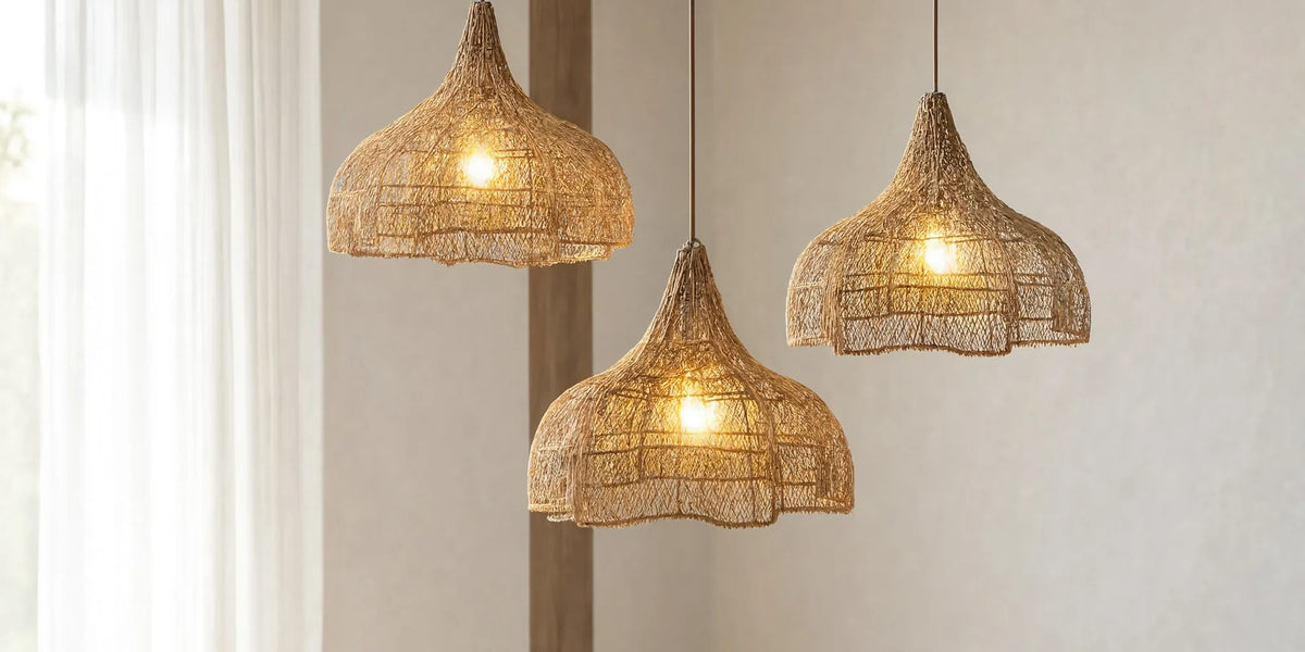 Three scalloped rattan pendant lights above a linen sofa