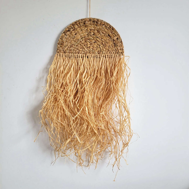 Free-form honey rattan wall art with irregular curves